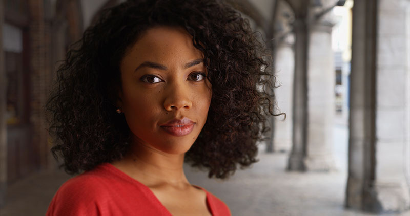 woman looking at the camera with a serious look on her face